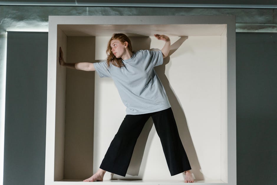 A woman trapped in a small box symbolizing claustrophobia and anxiety.