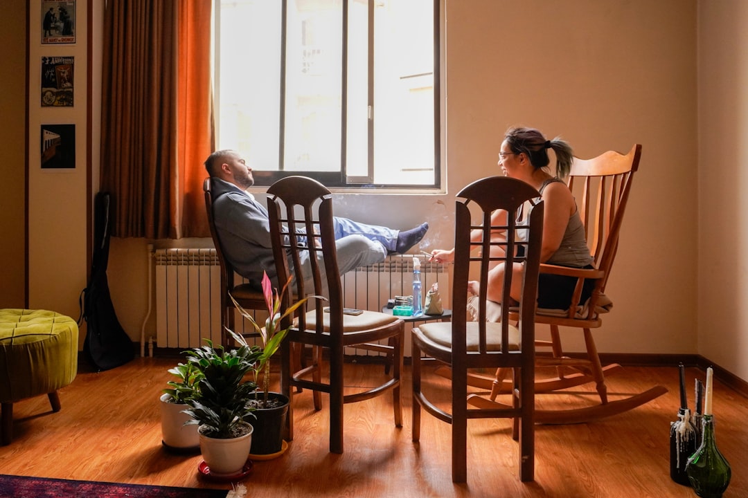 People are relaxing in a bright room.