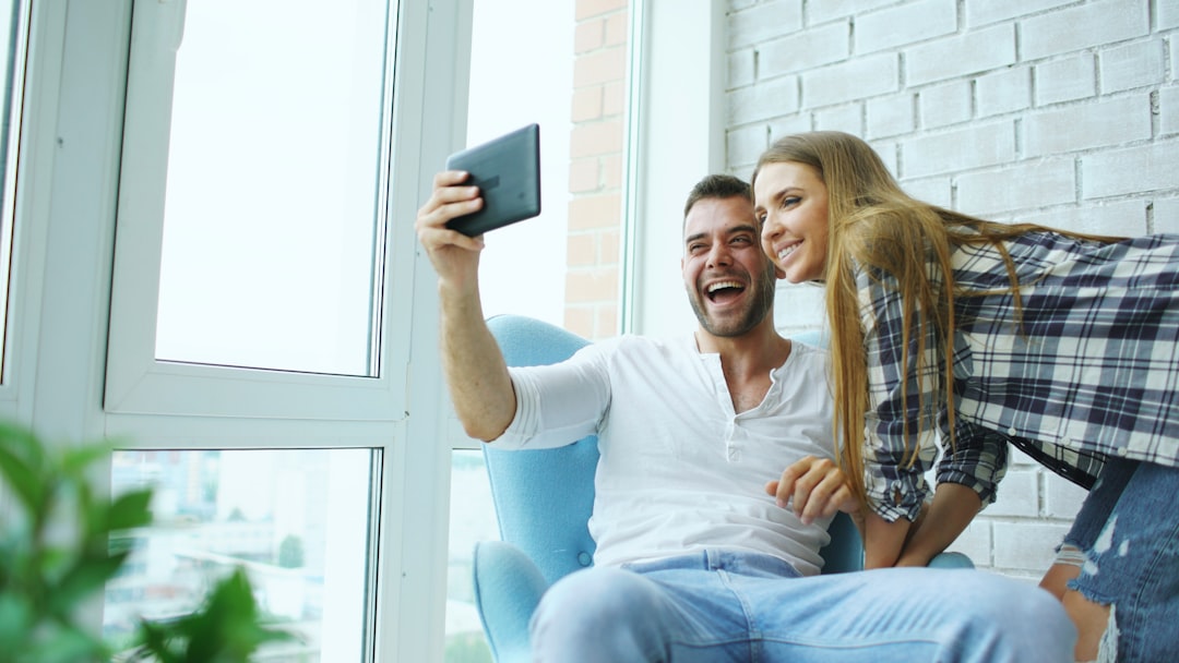 Couple taking a selfie with a tablet