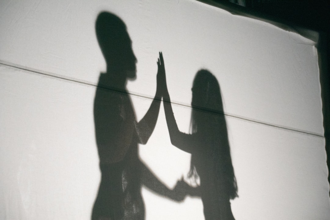 A shadow of two people holding hands