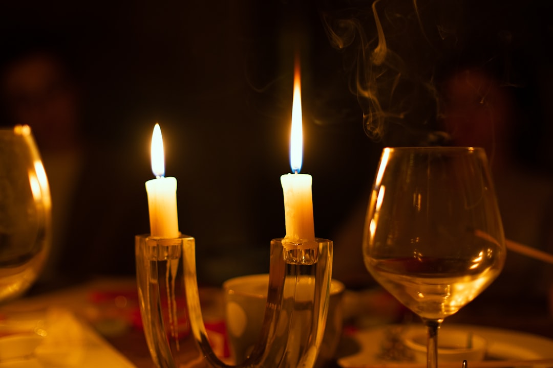 a couple of candles sitting on top of a table