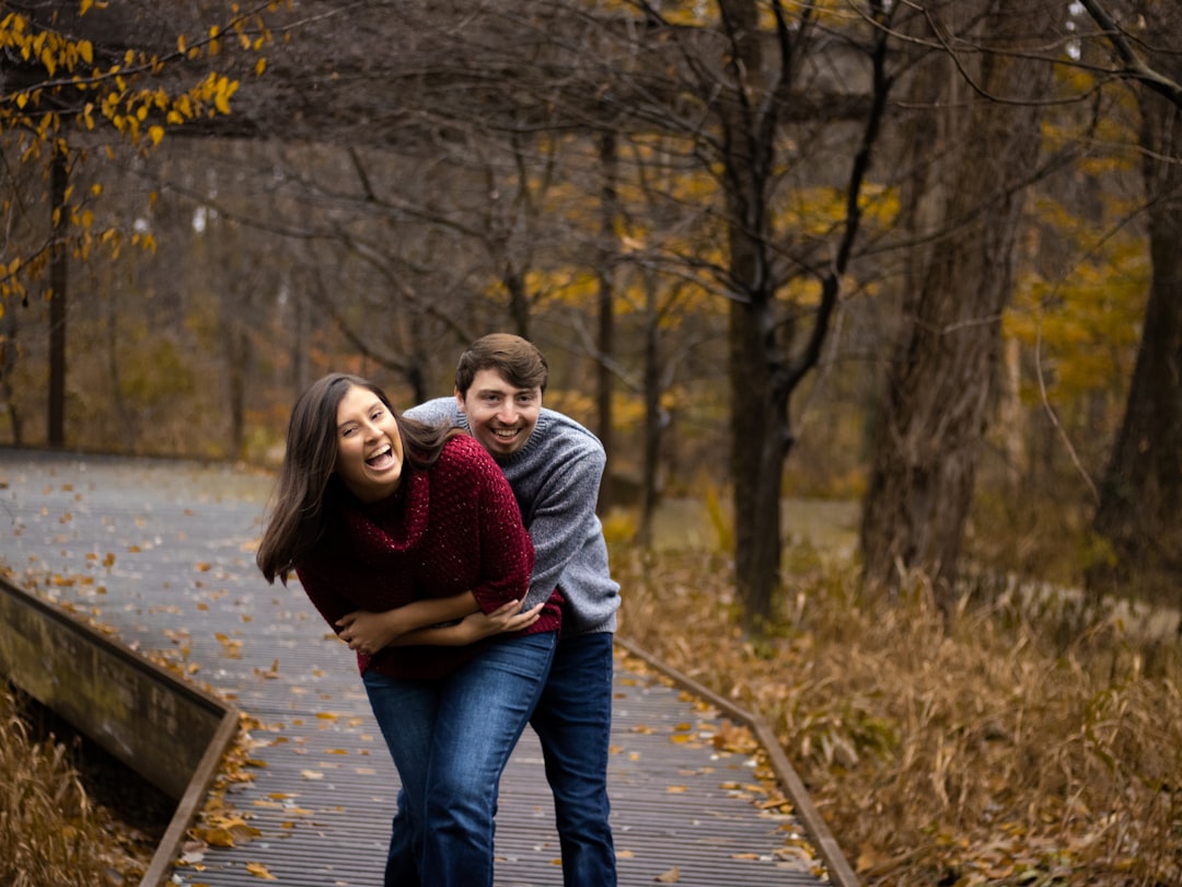 a couple of people that are standing on a bridge