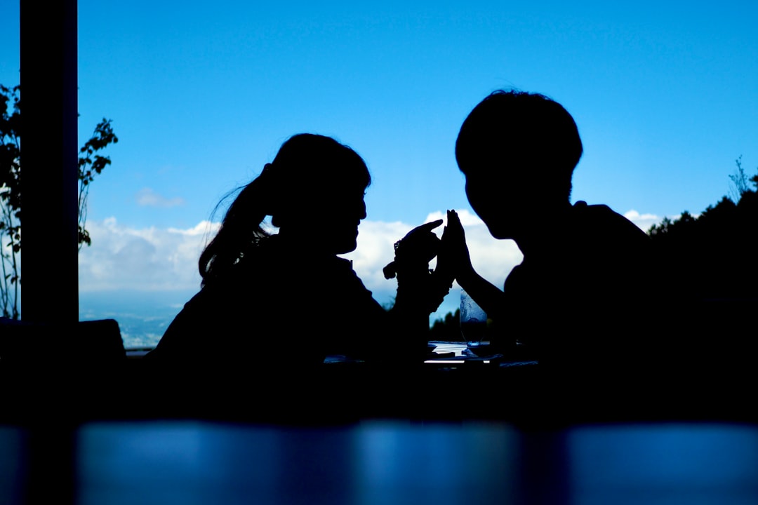 a man and a woman sitting next to each other